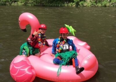 Two kids enjoying a float in the Nantahala River - Endless River Adventures