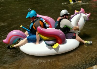 Two floaters in a Unicorn float on the Nantahala River - Endless River Adventures
